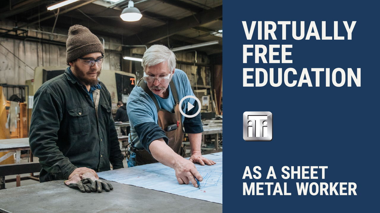 Two men discussing a blueprint in a workshop environment, representing apprenticeship training in sheet metal work.